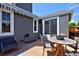 Charming patio with outdoor furniture and tasteful decor, ideal for entertaining or relaxing outside at 690 W Jamison Cir, Littleton, CO 80120