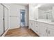 Main bathroom with double vanity, shower and walk-in closet at 1382 Rock Cliff Ave, Erie, CO 80516