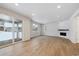 Living room with fireplace and sliding doors to patio at 1382 Rock Cliff Ave, Erie, CO 80516