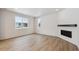 Living room with fireplace and large windows at 1382 Rock Cliff Ave, Erie, CO 80516