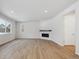 Spacious living room with fireplace and wood-look flooring at 1382 Rock Cliff Ave, Erie, CO 80516