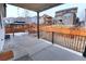 Covered patio overlooking a spacious backyard with wooden gazebo, fence, and manicured landscaping at 7470 Blue Water Ln, Castle Rock, CO 80108
