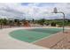 Outdoor basketball court area with an orange bench and a shaded picnic area in a landscaped setting at 7470 Blue Water Ln, Castle Rock, CO 80108