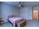 A cozy bedroom featuring a ceiling fan, with a nice window at 7470 Blue Water Ln, Castle Rock, CO 80108
