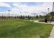 Picnic table and bike rack on a grassy common area surrounded by mature trees at 7470 Blue Water Ln, Castle Rock, CO 80108