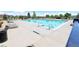 Community pool with lounge chairs and well-maintained surrounding concrete at 7470 Blue Water Ln, Castle Rock, CO 80108