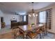 Open living room with a fireplace, leather seating, and lots of natural light at 7470 Blue Water Ln, Castle Rock, CO 80108