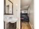 Bathroom featuring a sink and vanity area adjacent to a bedroom at 11797 Keough Dr, Northglenn, CO 80233
