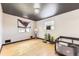 Well-lit bedroom showcasing hardwood floors, and ample space at 11797 Keough Dr, Northglenn, CO 80233