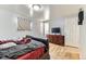 Bedroom with hardwood floors, a dresser, and natural light; a comfortable and inviting space at 11797 Keough Dr, Northglenn, CO 80233