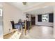Cozy dining area adjacent to the living room, featuring hardwood floors and natural light at 11797 Keough Dr, Northglenn, CO 80233