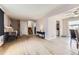 Open-concept living room with hardwood floors and view to stairs at 11797 Keough Dr, Northglenn, CO 80233