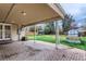 Covered patio with backyard view of shed, garden, and wooden fence at 2965 S Birch St, Denver, CO 80222