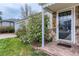 Close up of home's entrance with charming stone porch, mature landscaping, and house number displayed at 2965 S Birch St, Denver, CO 80222