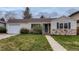 Charming single-story home with stone accents, well-maintained lawn, and attached one car garage in established neighborhood at 2965 S Birch St, Denver, CO 80222
