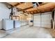 Spacious garage with laundry area and garage door at 2965 S Birch St, Denver, CO 80222