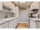 Efficient kitchen featuring white cabinetry, modern appliances, and ample counter space for cooking at 2965 S Birch St, Denver, CO 80222