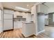 Functional kitchen with white cabinets, skylight and efficient layout, providing a bright workspace at 2965 S Birch St, Denver, CO 80222