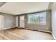 Spacious living room featuring hardwood floors, a large picture window, and ample natural light at 2965 S Birch St, Denver, CO 80222