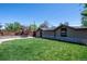 Well-manicured lawn and tasteful landscaping create a private backyard oasis at 380 S Jersey St, Denver, CO 80224