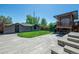 Serene backyard retreat with playset, lush lawn, and stone patio at 380 S Jersey St, Denver, CO 80224
