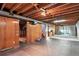 Unfinished basement with exposed beams and duct work, ready for personalization and ample storage at 380 S Jersey St, Denver, CO 80224
