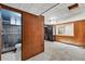 Spacious basement bathroom with wood-paneled walls and a tiled walk-in shower at 380 S Jersey St, Denver, CO 80224