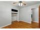 An empty bedroom features hardwood floors, light gray walls, a ceiling fan, and a loft-style closet at 380 S Jersey St, Denver, CO 80224