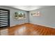 Bright bedroom with hardwood floors and a view of the outdoors at 380 S Jersey St, Denver, CO 80224