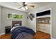 This charming bedroom features hardwood floors, a ceiling fan, and a cozy built-in loft bed at 380 S Jersey St, Denver, CO 80224