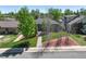 Charming home with a well-maintained front yard, mature trees, and a welcoming walkway to the front entrance at 380 S Jersey St, Denver, CO 80224