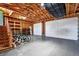 Spacious two-car garage with high ceilings, exposed beams, and ample storage; perfect for your projects and vehicles at 380 S Jersey St, Denver, CO 80224