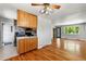 Open floor plan featuring the kitchen, stainless steel appliances, and hardwood floors at 380 S Jersey St, Denver, CO 80224
