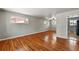 Open-concept living space with hardwood floors and neutral gray walls at 380 S Jersey St, Denver, CO 80224