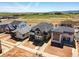 New construction homes with well-maintained yards in a neighborhood with scenic views of green fields and mountains at 7291 Prairie Sage Pl, Littleton, CO 80125