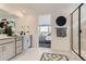 Modern bathroom featuring double vanity, sleek fixtures, and a separate glass-enclosed shower at 7291 Prairie Sage Pl, Littleton, CO 80125