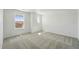 Neutral carpeted bedroom featuring a window with natural light at 7291 Prairie Sage Pl, Littleton, CO 80125