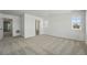 Neutral carpeted bedroom featuring a window with natural light and closet access at 7291 Prairie Sage Pl, Littleton, CO 80125