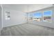 Large bedroom with multiple bright windows offering great sunlight and neutral carpet at 7291 Prairie Sage Pl, Littleton, CO 80125