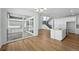 Open dining area featuring sliding doors and view into modern kitchen at 7291 Prairie Sage Pl, Littleton, CO 80125