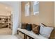 Inviting entryway with bench, shelving and natural light at 7291 Prairie Sage Pl, Littleton, CO 80125