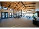 Spacious lounge area featuring high ceilings, stone fireplace and comfortable seating at 7291 Prairie Sage Pl, Littleton, CO 80125