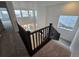 Staircase landing overlooking the two-story ceiling, and windows that let in natural light at 7291 Prairie Sage Pl, Littleton, CO 80125