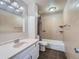Clean bathroom with tile floors and combined shower and tub at 15139 E Wesley Ave, Aurora, CO 80014