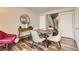 Dining area featuring modern furniture, a decorative mirror and views into the house at 15139 E Wesley Ave, Aurora, CO 80014