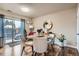 Bright dining area with a patio view and modern decor at 15139 E Wesley Ave, Aurora, CO 80014