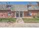 Charming brick townhouse with a well-maintained lawn and inviting entrance at 15139 E Wesley Ave, Aurora, CO 80014