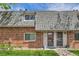 Charming townhome featuring a brick facade, complemented by well-maintained landscaping and a welcoming entrance at 15139 E Wesley Ave, Aurora, CO 80014