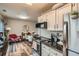 Open concept kitchen with modern appliances and dining area at 15139 E Wesley Ave, Aurora, CO 80014