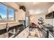 Bright kitchen seamlessly connects to the dining area, enhancing the flow of the space at 15139 E Wesley Ave, Aurora, CO 80014